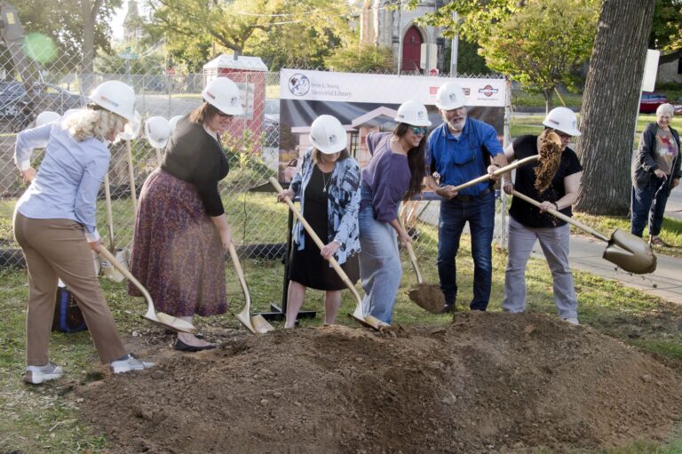 library staff and trustees breaking ground on the building project