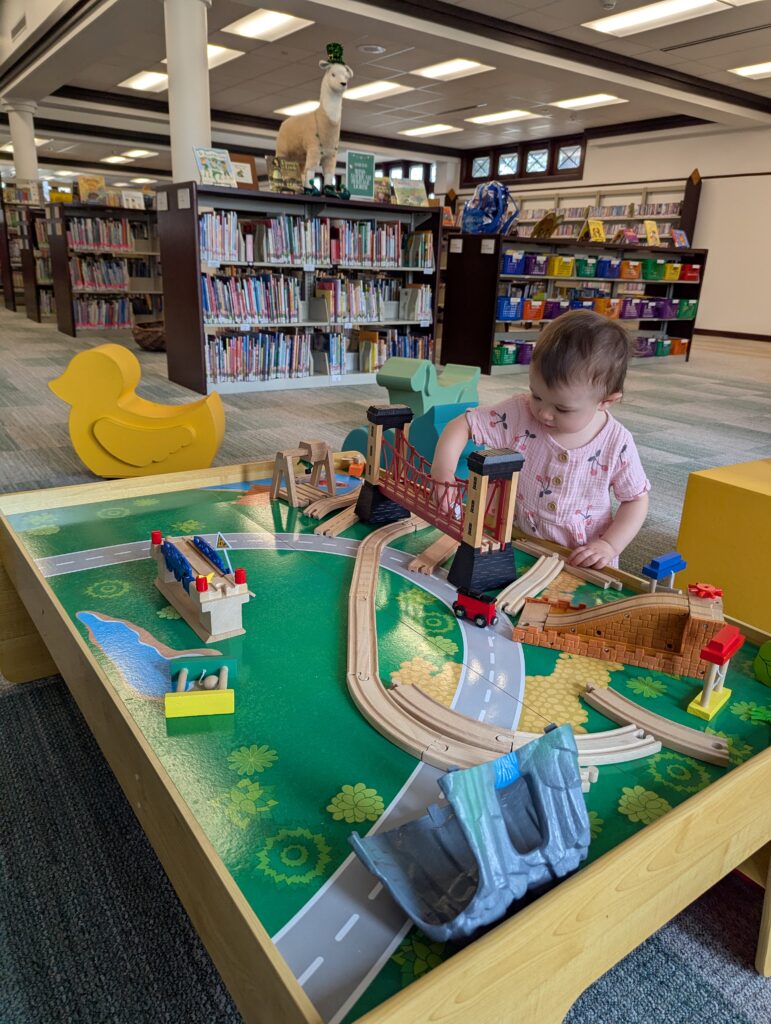 child playing with trains