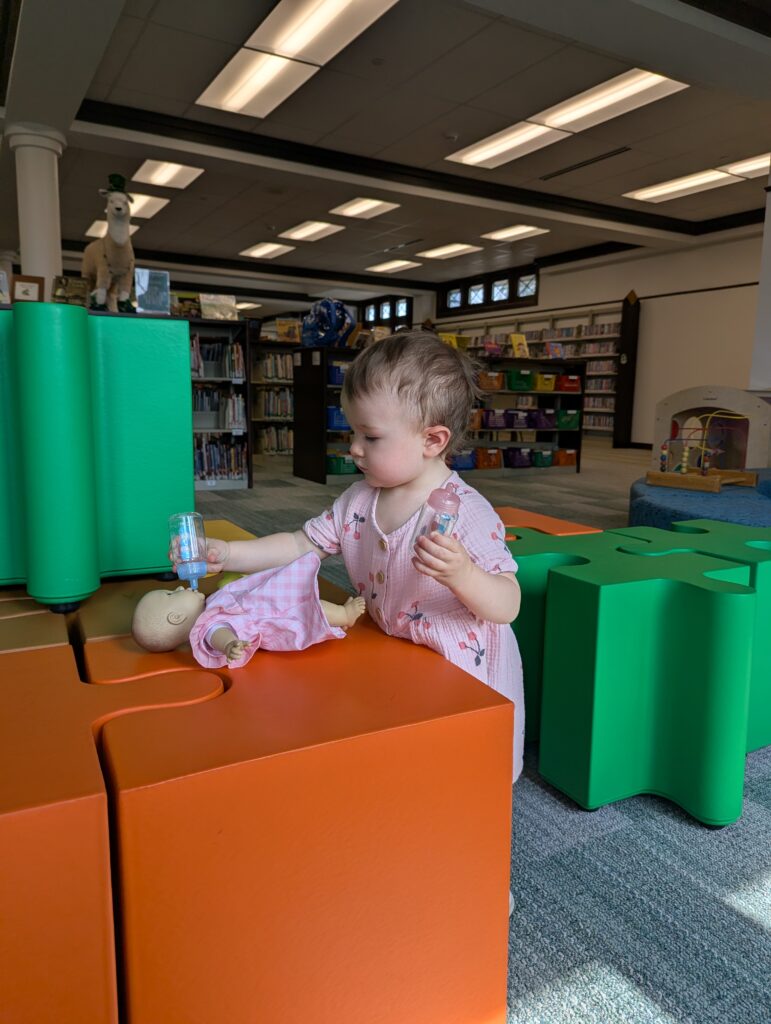 child playing with doll